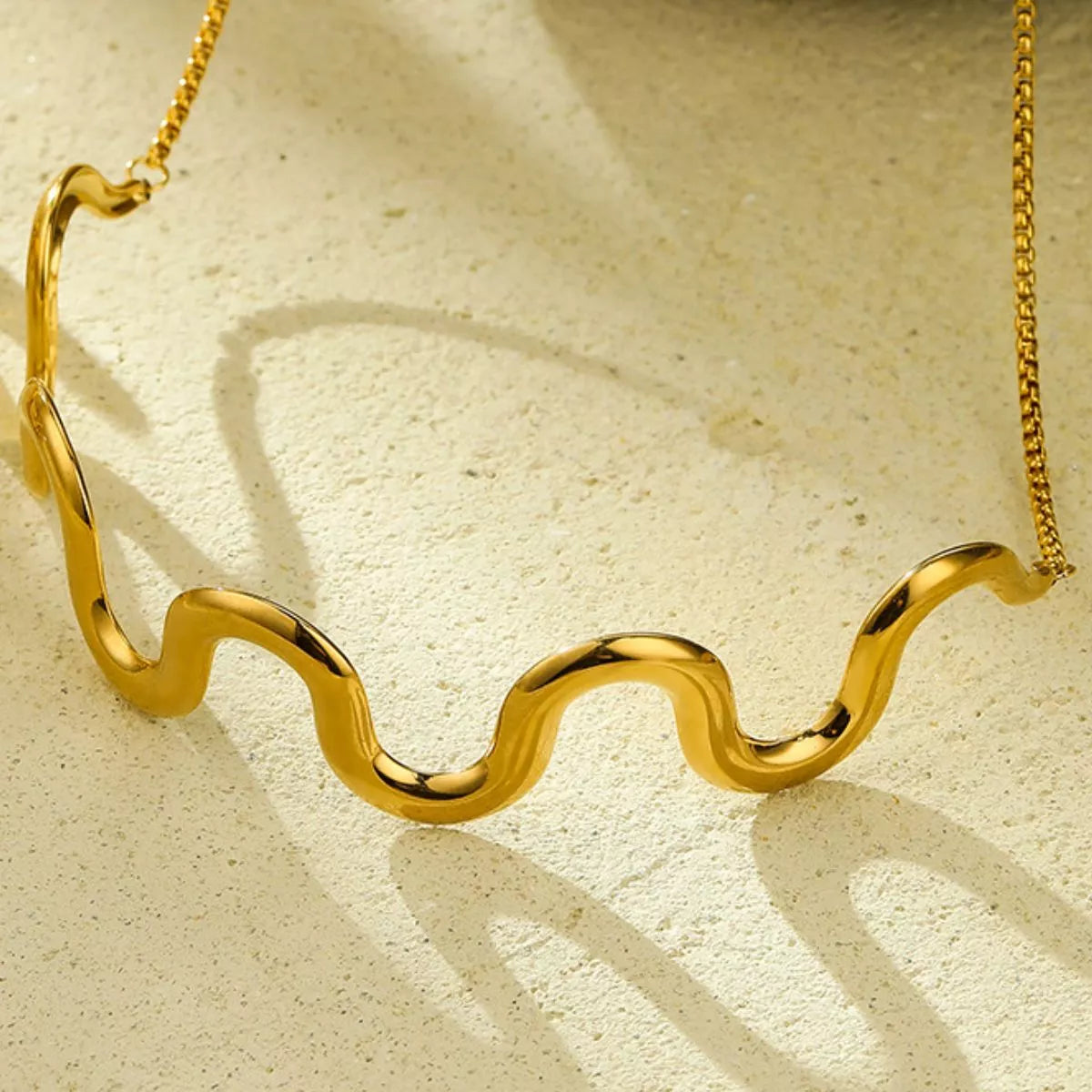 elegance with our 18K gold-plated wave necklace.