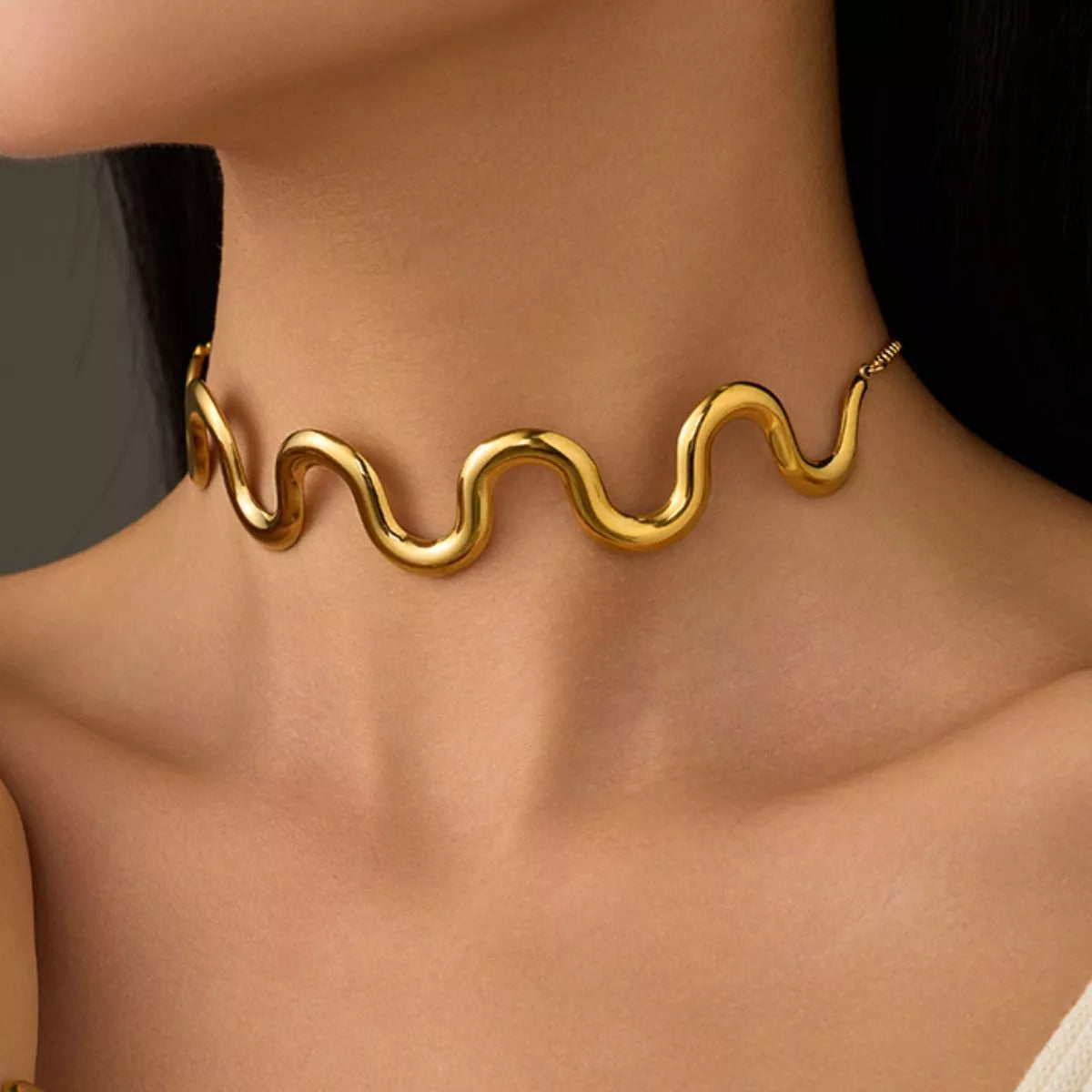  elegance with our 18K gold-plated wave necklace.